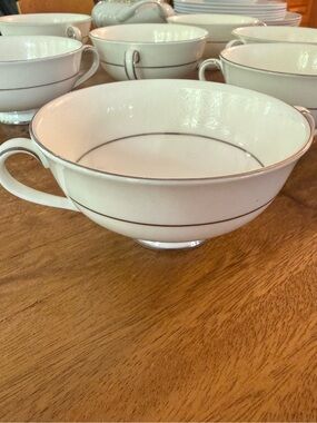 Elegant Cream Porcelain Tea Cup with Silver Trim - Setpiece